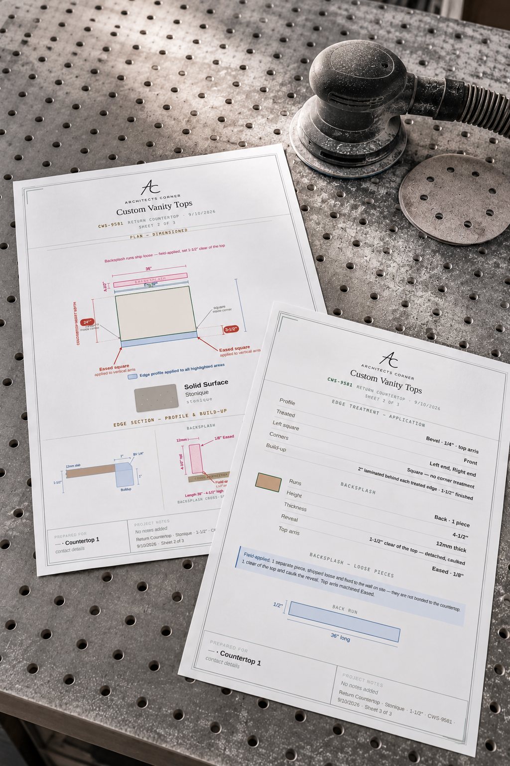 Two Custom Vanity Tops spec sheets on a steel fabrication bench beside a random-orbit sander — sheet 2 showing the dimensioned plan with the backsplash run and edge section, sheet 3 the edge treatment schedule.