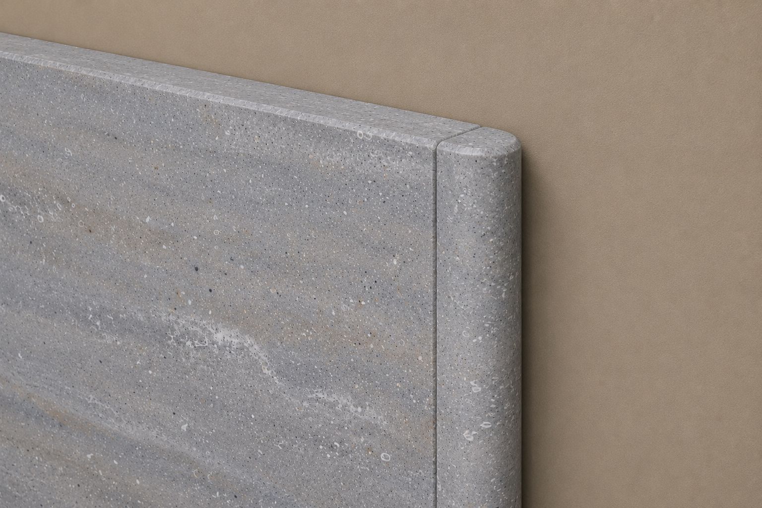 Solid-surface wall cap with a rounded bullnose edge